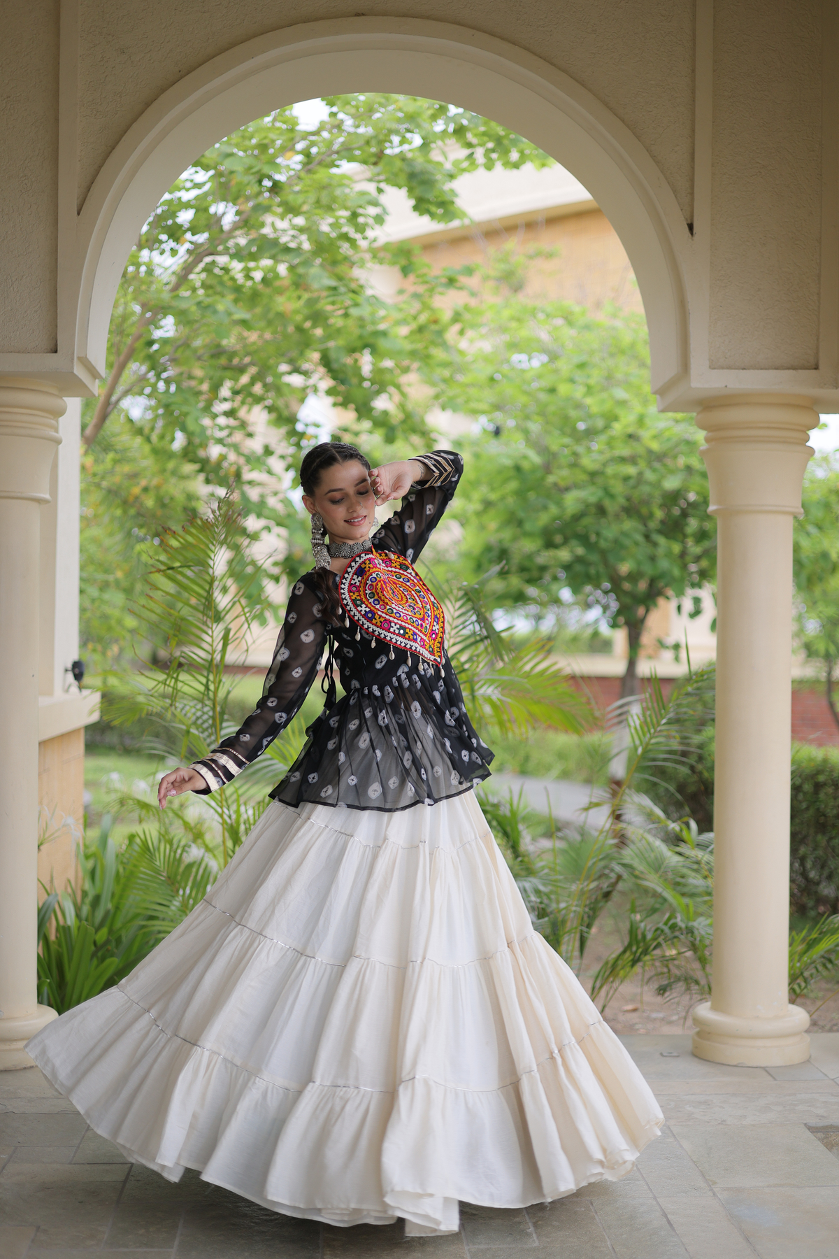 Women’s Designer Black Embroidered Peplum Top with White Flared Lehenga Skirt